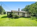 Charming house exterior, showcasing a screened porch at 155 Tye St, Stockbridge, GA 30281