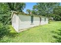 Side view of a small house with white siding at 155 Tye St, Stockbridge, GA 30281