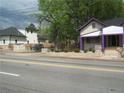 Street view of two houses; one is white with purple trim at 916 Metropolitan Sw Pkwy, Atlanta, GA 30310