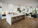 Open concept kitchen features a large island with seating and modern appliances at 1585 S Ponce De Leon Ave # 7, Atlanta, GA 30307
