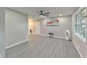 Spacious living room with grey flooring and modern ceiling fan at 2592 Candler Woods Dr, Decatur, GA 30032