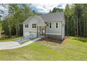 Gray two-story house with stone accents and a front porch at 1200 Awenasa Dr, Villa Rica, GA 30180