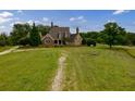 Brick and shingle home with large yard and multiple chimneys at 1850 Newborn Rd, Rutledge, GA 30663