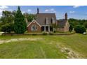 Brick and shingle home with large yard and multiple chimneys at 1850 Newborn Rd, Rutledge, GA 30663