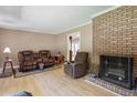 Living room with fireplace, hardwood floors, and comfortable seating at 2279 Highway 92, Acworth, GA 30102