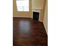 Living room with fireplace and dark wood floors at 405 Lake Ridge Ln, Fairburn, GA 30213