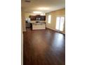 Open kitchen with dark cabinets and a large island at 405 Lake Ridge Ln, Fairburn, GA 30213