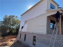 House exterior being painted; two story with brick and siding at 2255 Buford Dam Rd, Buford, GA 30518