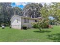 Side view of the house showcasing a large green lawn at 543 Patillo Rd, Stockbridge, GA 30281