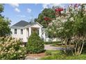 Elegant two-story home with manicured landscaping and a paved driveway at 721 Club S Ln, Marietta, GA 30067