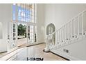 Bright and spacious entryway with a grand staircase and tiled floors at 721 Club S Ln, Marietta, GA 30067