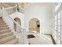 Stunning staircase with a white balustrade and beige carpeting at 721 Club S Ln, Marietta, GA 30067