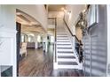 Bright and spacious entryway with hardwood floors and staircase at 1025 Fable Ln, Hampton, GA 30228