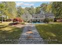 Home's backyard features a pool and a stone pathway at 1199 Old Lathemtown Rd, Canton, GA 30115