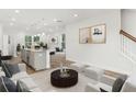 Open living room featuring a spacious layout, and large windows at 98 Werner Brook Sw Way, Atlanta, GA 30354