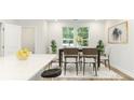 Bright dining room with hardwood floors and large windows at 98 Werner Brook Sw Way, Atlanta, GA 30354