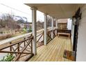 Inviting front porch with wooden railings and a view of the neighborhood at 154 Graves Nw St, Atlanta, GA 30314