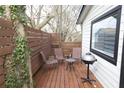 Small deck with seating and grill, surrounded by a fence at 154 Graves Nw St, Atlanta, GA 30314