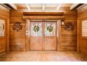 Inviting entryway with double doors and wood-paneled walls at 1785 Whitley Rd, Dacula, GA 30019