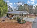 Ranch home with carport, detached workshop, and spacious yard at 991 Grassdale Nw Rd, Cartersville, GA 30121