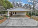 Two-car carport attached to a workshop and storage area at 991 Grassdale Nw Rd, Cartersville, GA 30121