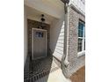 Gray front door entry with brick walkway at 368 Lakeside Court, Canton, GA 30114