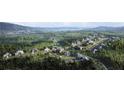 Aerial view of a new luxury home community nestled in a scenic landscape at 6000 Diamond Ln, South Fulton, GA 30213