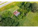 Aerial view of a rustic barn in a wooded area at 831 Angham Rd, Hiram, GA 30141