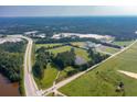 Aerial view of property near highway and large pond at 829 Angham Rd, Hiram, GA 30141