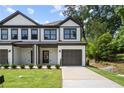 Two-story townhome with attached garage and modern exterior at 1321 Parc Bench Rd, Atlanta, GA 30316