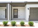 Modern townhome entry with dark gray door and white brick at 1321 Parc Bench Rd, Atlanta, GA 30316