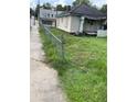 A fixer-upper home with a yard needing landscaping at 1120 Mcdaniel Sw St, Atlanta, GA 30310