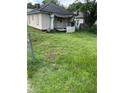 A fixer-upper home with overgrown grass at 1120 Mcdaniel Sw St, Atlanta, GA 30310