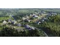 Aerial view of a luxury community with many homes, trees and open green spaces at 6024 Diamond Ln, South Fulton, GA 30213