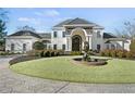 Luxury home with circular driveway and fountain at 4571 Columns Se Dr, Marietta, GA 30067