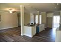 Open concept kitchen with island and white cabinetry at 2299 Brown Dove Way, Grayson, GA 30017