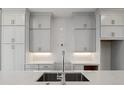 Modern kitchen with white cabinets and quartz countertops at 3667 Peachtree Ne Rd # 13, Atlanta, GA 30319