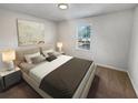 Spacious bedroom with a king-size bed and large window at 125 Enterprise Dr, Temple, GA 30179