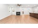 Spacious living room with hardwood floors, fireplace, and access to backyard at 428 10Th St, Auburn, GA 30011