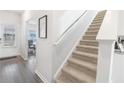 Carpeted staircase leading to the second floor at 11719 Chatham Dr, Hampton, GA 30228