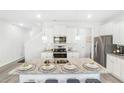 Modern kitchen with granite countertops and white cabinets at 11682 Chatham Dr, Hampton, GA 30228