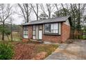 Brick ranch home with lake view and deck at 340 Sir Richard Ct, Jonesboro, GA 30236