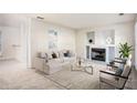 Living room with fireplace, built-in shelving, and neutral decor at 6674 Eastbriar Dr, Lithonia, GA 30058