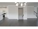 Bright dining room with hardwood floors and kitchen view at 577 Fundao Ln # 14, Lawrenceville, GA 30046