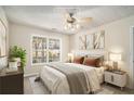 Virtually staged bedroom with large window and neutral decor at 1365 River Club Ne Dr, Conyers, GA 30012