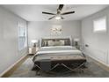 Main bedroom with plush bed, light walls and ceiling fan at 58 Montgomery Ne St, Atlanta, GA 30307