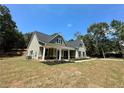 Two-story house with gray siding, stone accents, and a front porch at 22 Stratford Way, Kingston, GA 30145