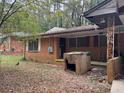 Brick house with side yard and mature trees at 2364 El Paso Sw Rd, Atlanta, GA 30331