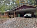 Brick ranch house with carport and mature trees at 2364 El Paso Sw Rd, Atlanta, GA 30331