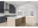 Modern kitchen with marble countertops, stainless steel appliances, and dark cabinetry at 110 Sheridan Ne Dr, Atlanta, GA 30305